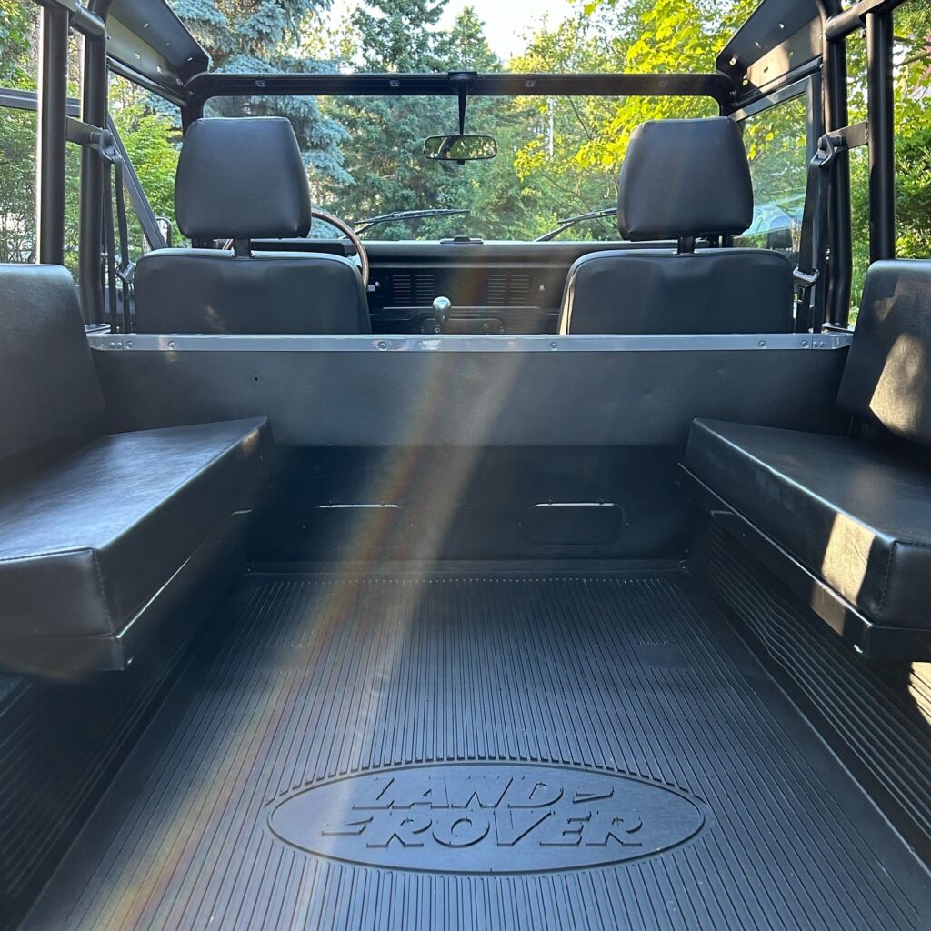Rear tub of The Nazaré with black Exmoor Trim vinyl seats and rubber flooring