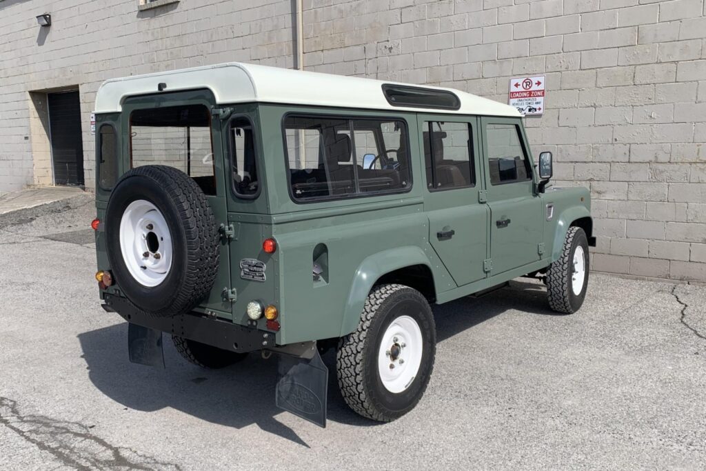 Rear three-quarter view of The Nomad showing the spare wheel and white roof