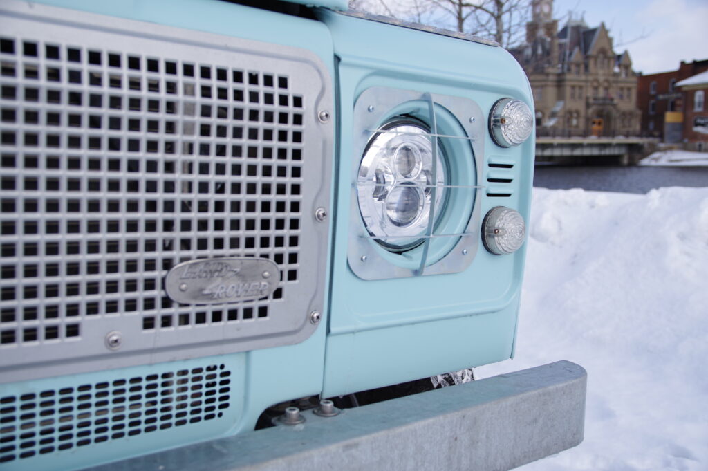 Close-up of Blue Crush's Heritage grille and LED headlight in matte Sonic Blue