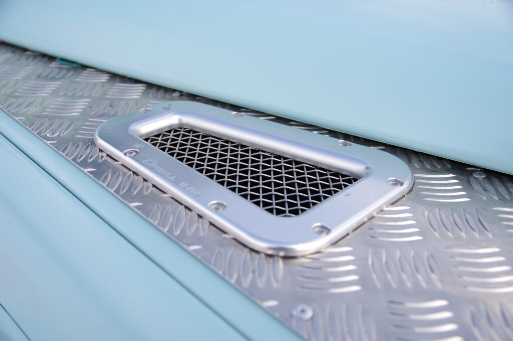 Optimill billet aluminum vent grille on chequer plate, Blue Crush