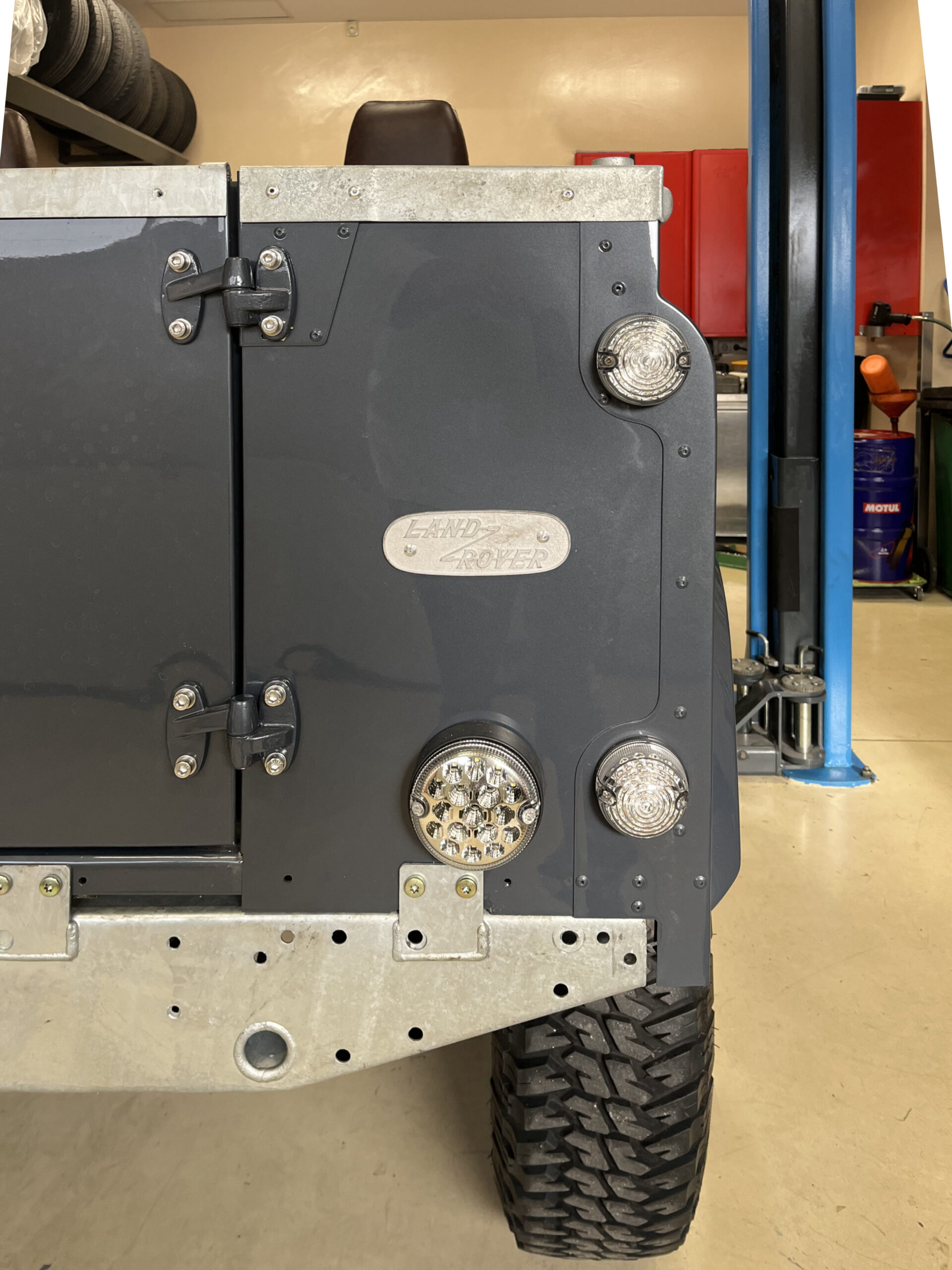 The Ninety's rear door with crystal-clear LED lights, plated hinges and the galvanized rear crossmember