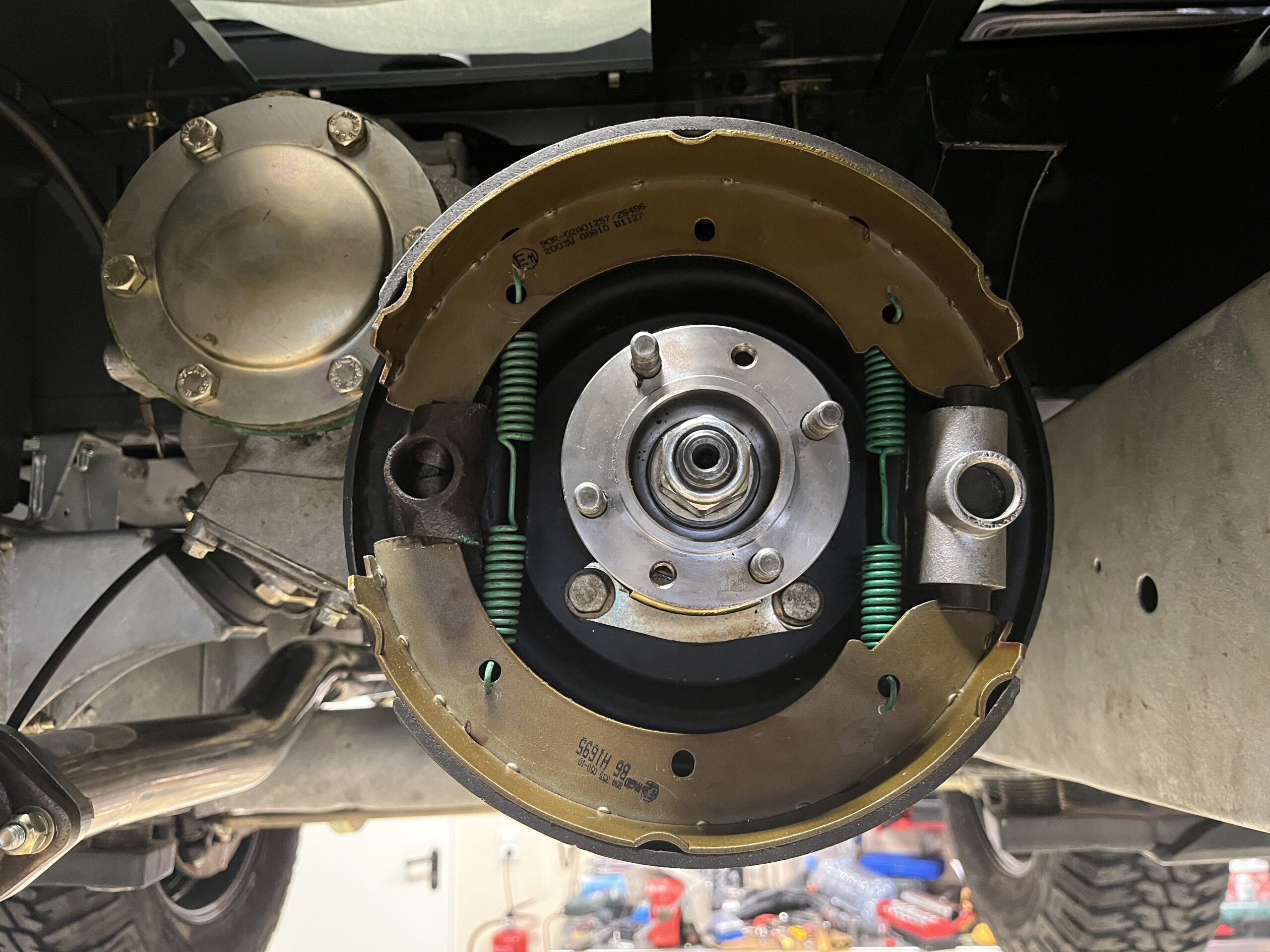 The Ninety's rebuilt rear drum brake with new shoes and wheel cylinder, on the galvanized chassis