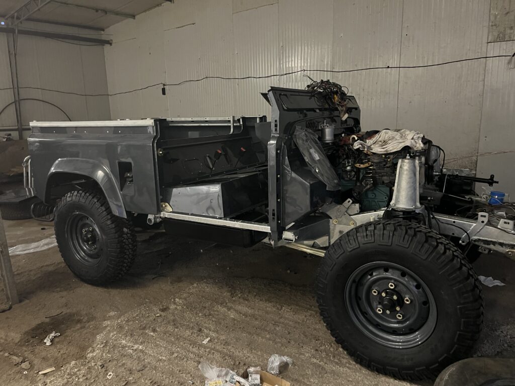 The Ninety coming back together: bulkhead and rear tub on the chassis, painted in Polymetal Grey