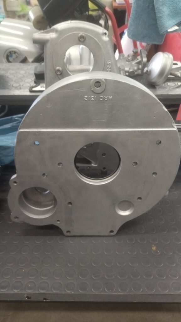 A freshly blasted replacement bell housing for the Ninety's gearbox